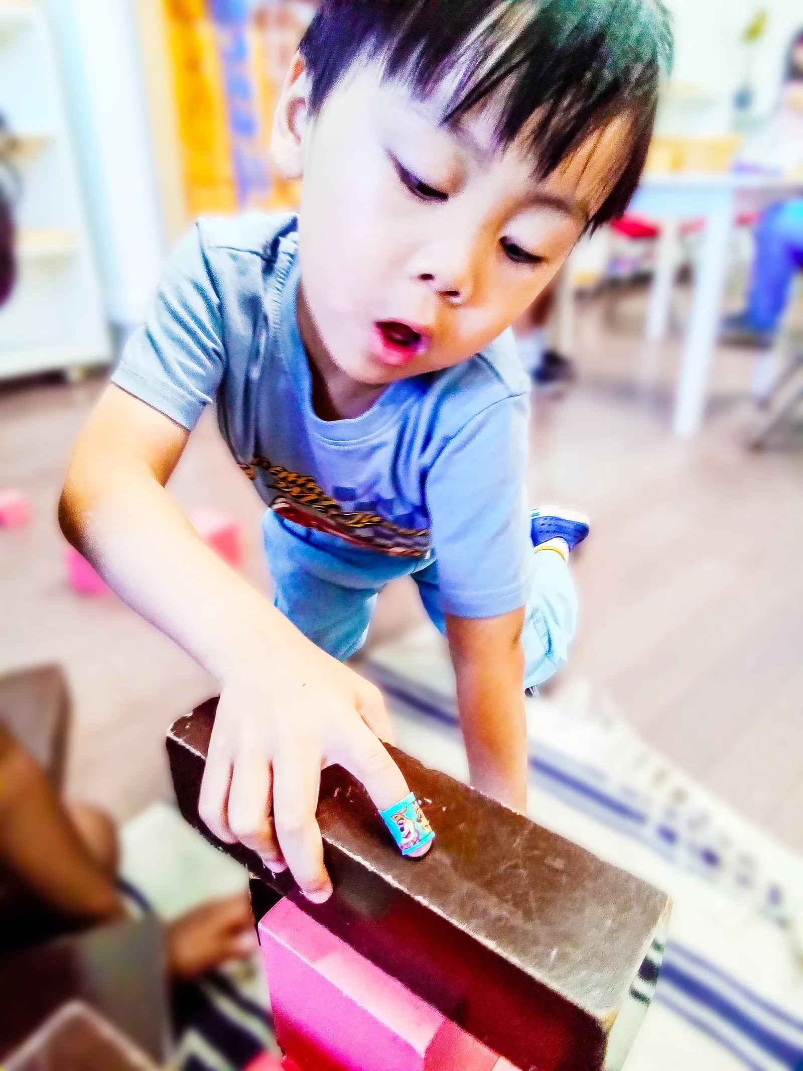 A child working independently with Montessori materials at ACE Montessori.